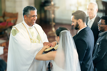 Image showing Happy priest, wedding and couple in church for ceremony, service or celebration with bible, witness and God. Father, bride and man with spiritual book for love, vows and marriage in christian event