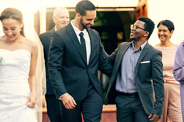 Image showing Wedding, friends and celebration with men outdoor after ceremony at the church for commitment, love and marriage. Diversity, family and support for man or groom feeling happy about love and decision