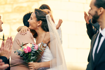 Image showing Wedding, marriage and bride hug family guests with a smile while leave church with groom after marrying, celebration and event to celebrate love. Romance, commitment and happy married couple together