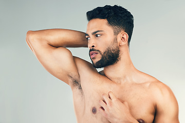 Image showing Fitness, bicep and man flexing in a studio for strength, health and wellness from exercise. Sports, workout and healthy guy with strength, power and muscles after training isolated by gray background