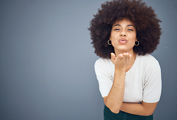 Image showing Blow kiss, black woman and mockup showing love, smile and happy kissing with beauty. Model from New York with natural hair, happiness and mock up space loving romance and skincare wellness in studio