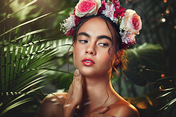 Image showing Flowers, nature and beauty of a model in a forest with natural skincare, makeup and skin wellness. Woman with a flower crown in a forest or jungle with organic skin care and natural cosmetics