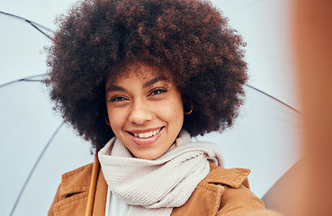 Image showing Woman, selfie closeup and umbrella in rain, water or drizzle in portrait, happiness and smile. Black woman, hair or afro beauty with parasol for protection from elements, climate or storm while happy