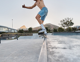 Image showing Skater, fitness and feet of man skateboarding in a park for fun, adventure and fitness. Sports, active and training of a guy using a board to skate outside in an urban city or town for exercise