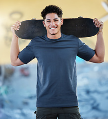 Image showing Skateboard, freedom and street sports with man outdoor for skating, exercise and training for competition, wellness and fun at skate park. Portrait of gen z skater with his board for sport and travel