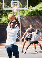 Image showing Basketball, sports and athlete scoring during game or training on an outdoor court in the city. Score, goal and man playing, practicing or doing an exercise for championship match on basketball court