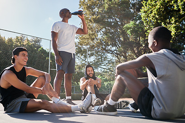 Image showing Friends, sports and team relax after training on basketball court outdoors. Young athlete men, exercise workout rest and happy teamwork conversation or group discussion together in nature park