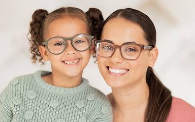 Image showing Mother, girl and glasses in optometry shop, frame and happy after shopping in retail store with smile for vision result. Portrait of latino mom, child and happiness with optical lense at optometrist