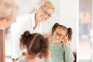 Image showing Eye care, girl and optometrist help with vision, prescription glasses and eye test for childcare. Child, eyes and medical professional talking about clear sight for reading, improvement and eyewear.