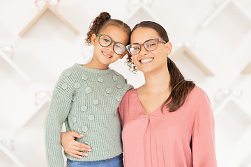 Image showing Portrait, mother and girl with glasses for vision, hug and smile being happy for eye care, loving and eye exam together. Eyewear, mama and daughter embrace, eyesight and healthcare for strong eyes.