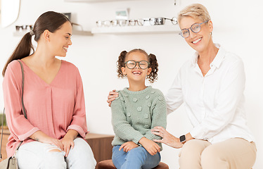 Image showing Children, glasses and optometry with a mother and daughter at the optician for an eye test. Vision, family and retail with a woman and girl customer shopping for prescription lenses at an optometrist