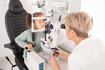 Image showing Girl child in eye exam for vision, woman optician checking kids eyes in consultation room and medical test. Healthcare professional consulting kid, young patient with optometrist or optical doctor