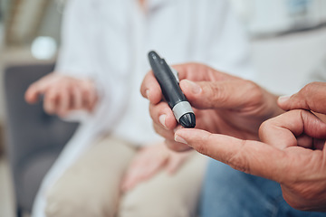 Image showing Finger, healthcare and diabetes with a senior man testing his blood sugar level while in his retirement home. Medical, wellness and test with a mature male using a glucometer to measure his glucose