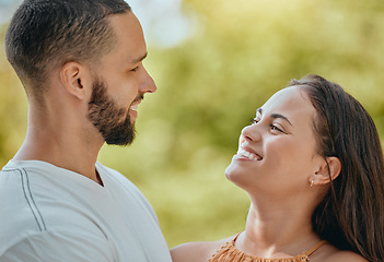 Image showing Happy, smile and love with a young couple together outdoor in nature on a green background during summer. Park, romance and dating with an affectionate man and woman bonding on a sunny day in nature