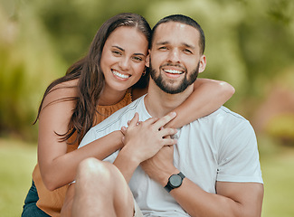 Image showing Love, portrait and couple in nature in peace for a relaxing holiday for bonding, romance and fresh air with freedom. Smile, peace and happy woman hugs and holding hands with a romantic man in a park