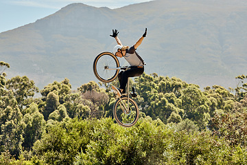 Image showing Mountain bike, nature and sports man jump in air with outdoor adventure, journey and training in bush or forest mock up for marketing. Risk, danger and sport bicycle person in sky freedom and fitness