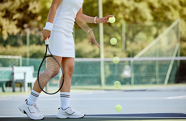 Image showing Woman, tennis and ball bounce on tennis court, training and fitness for game, match or play outdoor in uniform. Sports athlete, workout and exercise for health or wellness with racket and tennis ball