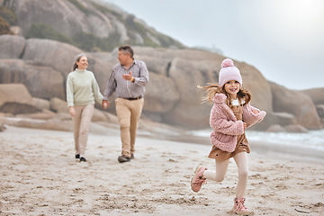 Image showing Grandparents, running kid and beach holiday, vacation and relax together for bonding, freedom or family time outdoors. Portrait of excited, happy and young girl child at ocean sand with senior family