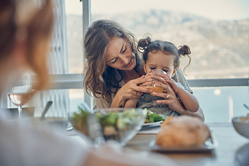 Image showing Mother, baby at lunch and drinking juice with family at dining room patio table, by the sea and on holiday. Girl child, loving mom and people bonding with food at seaside summer house for vacation