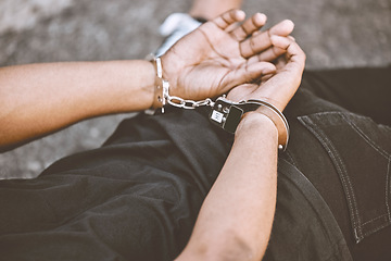 Image showing Arrest, justice and thief in handcuffs for fraud, violence and burglary after a suspected house robbery. Law, hands and gangster criminal going to jail or prison for violence and crime in Venezuela