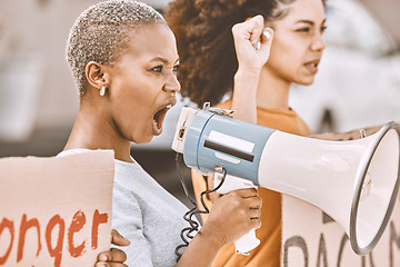 Image showing Protest, angry and black woman with a megaphone as leadership for social change, justice and freedom from government. Conflict, fight and African girl shouting during a rally against racism in city