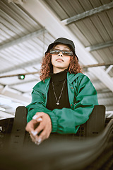 Image showing Youth, fashion and black woman in sunglasses city outdoor shopping mall or urban bridge and portrait for designer green. Teenager girl in streetwear clothes and glasses for hip hop brand lifestyle