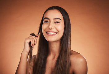 Image showing Cosmetics, hair care and young woman pride with natural beauty, healthy and confident with brown studio background. Portrait, makeup and girl playing with hair, wellness and organic for happiness.