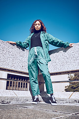 Image showing Green, designer and fashion black woman in urban city portrait pm blue sky mock up for marketing, advertising or youth promotion. Young gen z girl streetwear design clothes with mockup rooftop space
