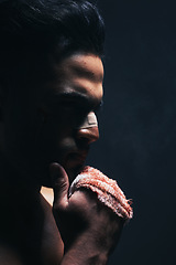 Image showing Boxing, blood and fight man in dark studio mock up for workout, fitness and training risk, danger and first aid sports marketing. Boxer, sports or power person with fist and nose injury for violence