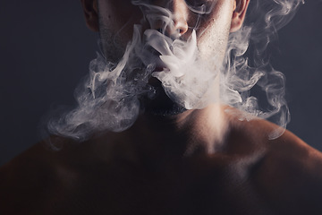 Image showing Smoke, cloud and face of man with pollution for marijuana smoker health campaign with zoom. Cannabis, weed and cbd addiction model for smoking habit lifestyle advertising in black studio.