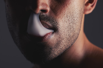 Image showing Smoke, black man and face marijuana with cancer awareness and with bad habit with black studio background. Addiction, mouth with smoking cloud and male with drug puff with weed, vape and cigarette.