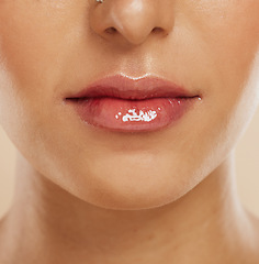 Image showing Lips, skincare and woman with lipstick for cosmetics, gloss and wellness for clear, smooth and glow skin. Natural beauty, healthy and girl or female with makeup for shiny mouth, fresh and collagen.