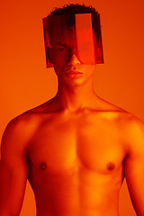 Image showing Body, glasses and red with a man model in studio on a color background for trendy or edgy fashion. Portrait, topless and style with a handsome young male wearing eyewear under bright lighting