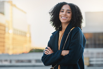 Image showing Black woman, city and smile portrait of a person by and urban building feeling relax and happy. Travel, freedom and happiness of a young female outdoor with a bag ready for traveling or work