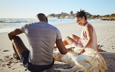 Image showing Fitness couple relax with dog at beach, sand and ocean after summer workout, free time and fun in sunshine together. Happy man, woman and people, labrador animal pets and freedom at calm sea outdoors