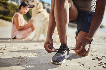 Image showing Fitness, shoes and lace on beach sand for running exercise, training or workout in the outdoors. Active runner tying shoe laces for a sports run, walk or healthy cardio on the sandy ocean coast