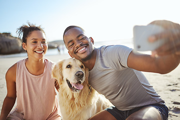 Image showing Couple, phone selfie and dog on beach for social media post, video call or memory vlog by ocean, sea or water. Smile, happy or bonding black woman, man and golden retriever in mobile photography tech