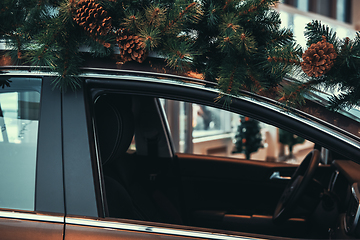 Image showing Car with christmas tree on roof