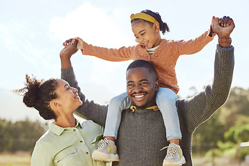 Image showing Lifting, smile and fun happy family play, bond or enjoy outdoor quality time together. Love, summer freedom or excited black father, mother or parents with kid girl with happiness on holiday vacation