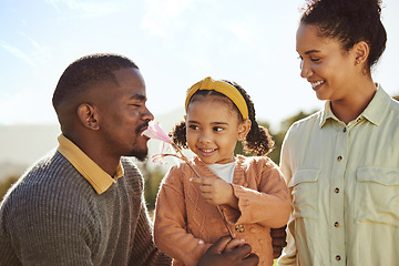 Image showing Countryside, nature and happy black family with child enjoying weekend, holiday and vacation in summer. Love, family and girl playing with flower with father and mom with fun, freedom and happiness