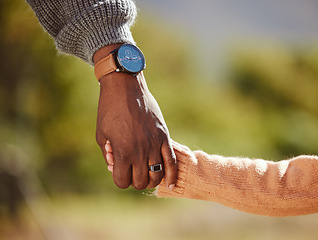 Image showing Family, love and child holding hands with parent in nature, outdoor park and countryside together. Summer, affection and black person hand with kid bonding and enjoying weekend, holiday and vacation