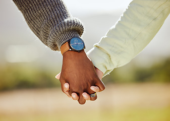 Image showing Love, trust and couple holding hands in nature for spring, support and happy in park together. Unity, summer and hope with hands of man and woman in countryside park for partnership, health and time