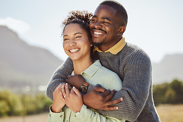 Image showing Black couple, hug and smile for countryside travel, trip or quality bonding time together in the outdoors. Man and woman hugging embracing relationship and enjoying vacation, traveling and nature