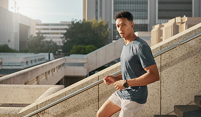 Image showing Man, running or city steps for fitness, heart health training or cardio workout in Brazilian urban location. Portrait, runner or sports athlete on stairs in wellness speed exercise for health goals