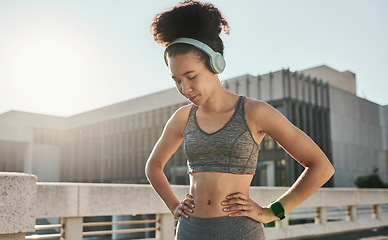 Image showing Woman, tired or music headphones in fitness break, workout rest or Brazil city training in health, wellness or cardio. Thinking runner, sports athlete or personal trainer listening to exercise radio