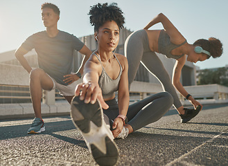 Image showing Fitness, team and friends stretching in city street for exercise run, marathon training run or cardio performance workout. Health commitment, focus and black people warm up while listening to music