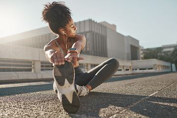 Image showing Fitness, city and woman stretching her legs in the street before a cardio workout, running or training. Sports, health and lady doing a warm up stretch for an outdoor exercise in the urban town road.