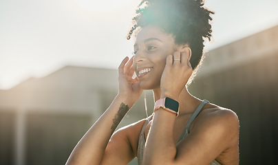 Image showing Fitness, music and black woman doing exercise in city with earphones, smile and ready for training. Workout, running and young female athlete doing sports in town listening to track, audio and radio