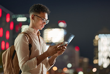 Image showing City night lights, man with phone, technology and futuristic communication online with bokeh. Social media, urban life and young hipster typing on smartphone with 5g connection on online digital app.