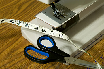 Image showing Sewing Machine, Scissors, And Tape Measure